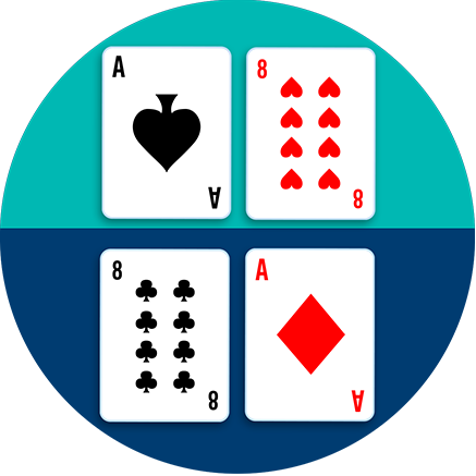 A table is divided in half, with an ace of spades beside an 8 of hearts on one side, and an 8 of clubs beside an Ace of diamonds on the other side.