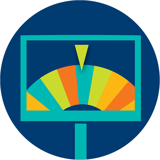 A monitor displays a multicoloured prize wheel with the pointer resting on a blue sliver.