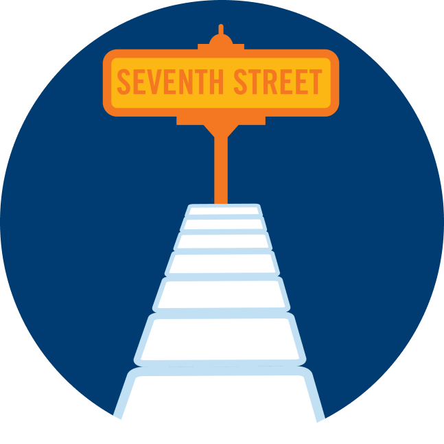 A street sign that says “Seventh Street” is at the end of a row of cards.