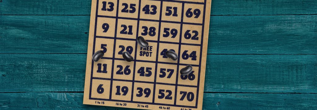 Bingo card with beans on top.
