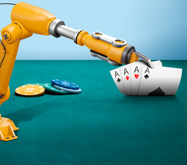 A robotic arm reveals four cards: an Ace of Clubs, an Ace of Diamonds, an Ace of Hearts and an Ace of Spades. Next to the cards is a small stack of casino chips.
