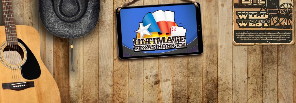 Against a wooden wall is a guitar, a cowboy hat, a tablet and a Western poster. The tablet screen shows imagery for an Ultimate Texas Hold’em digital offering.