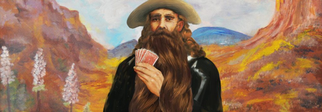 A man with long hair and a long beard is seen holding cards