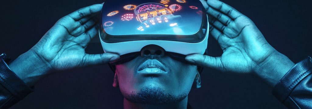 A Virtual Reality headset is held up. Casino imagery is reflected on the surface of the headset lenses.
