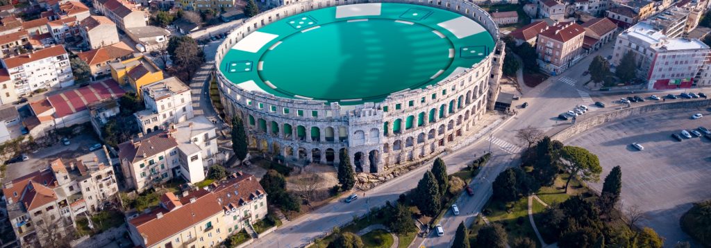 The Colosseum is shown with an enlarged poker chip inside.