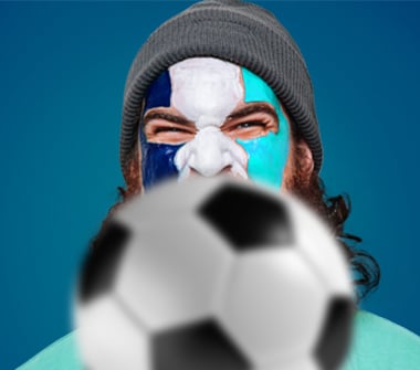 Man with painted face and soccer ball.