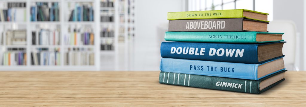 Stack of books on top of a table.